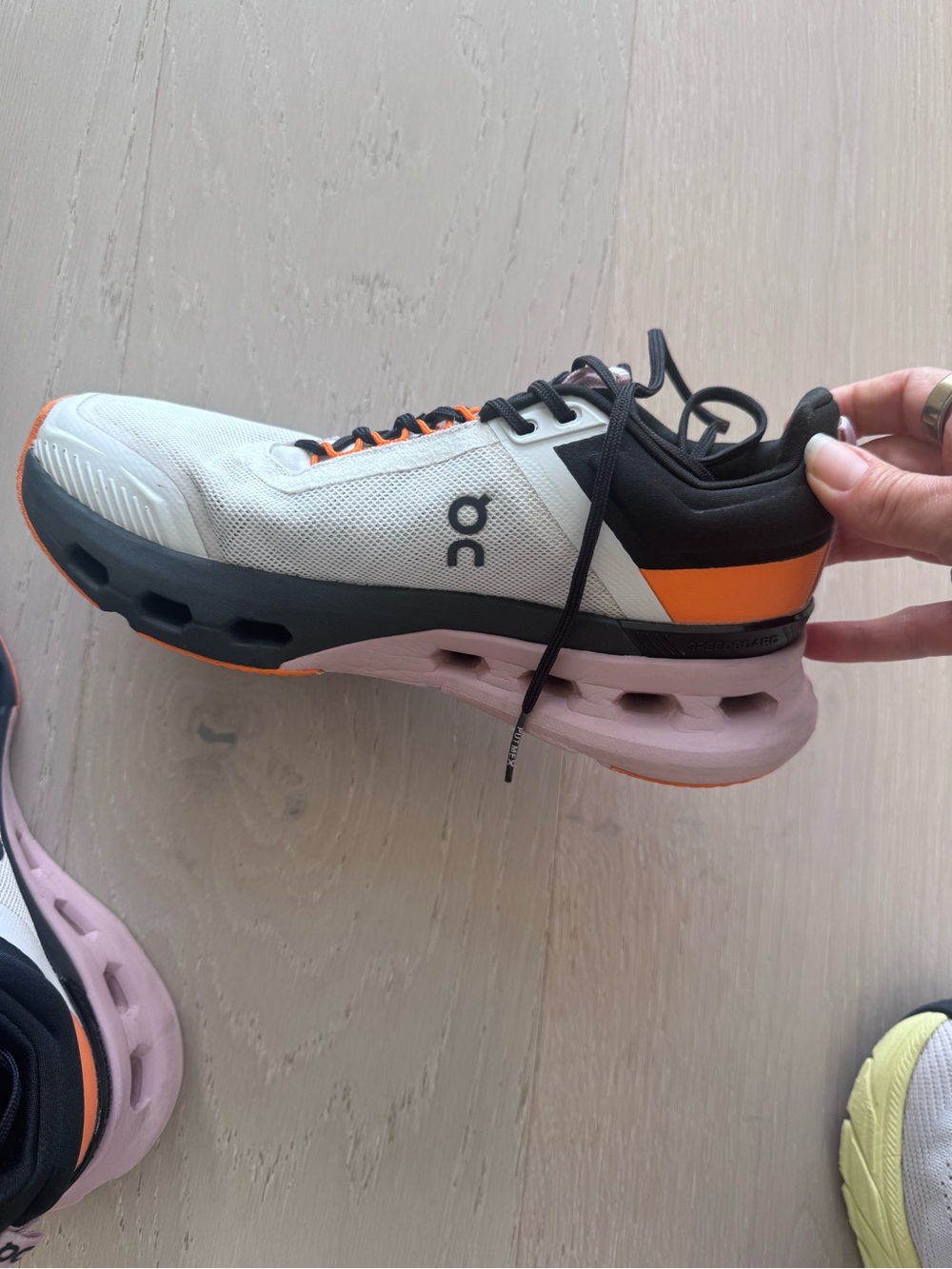 On Running Women's Neutral Trainer - White with Black, Orange & Pink